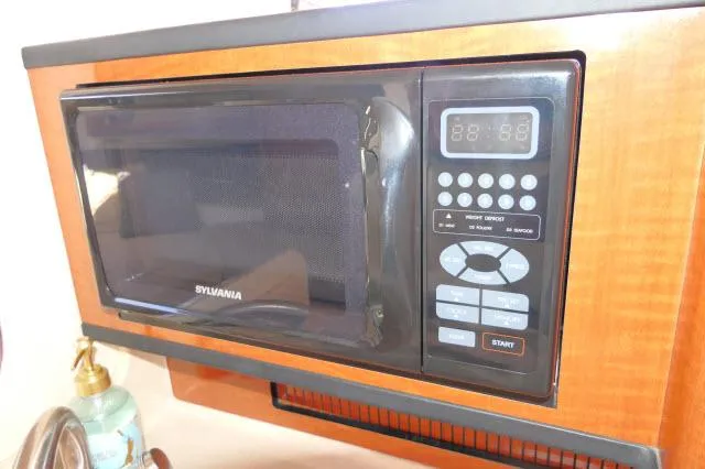 Slide: The Image of Microwave in 2005 Sea Ray 280 Sundancer boat kitchen area. - 12