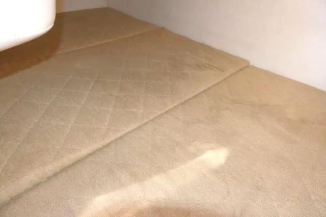 Slide: The Image of Interior cabin of 2005 Sea Ray 280 Sundancer with beige upholstery. - 25