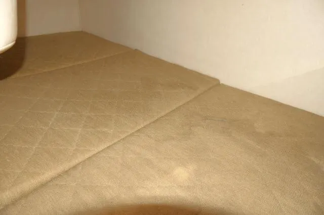 Slide: The Image of Interior cabin of 2005 Sea Ray 280 Sundancer with beige upholstery. - 26