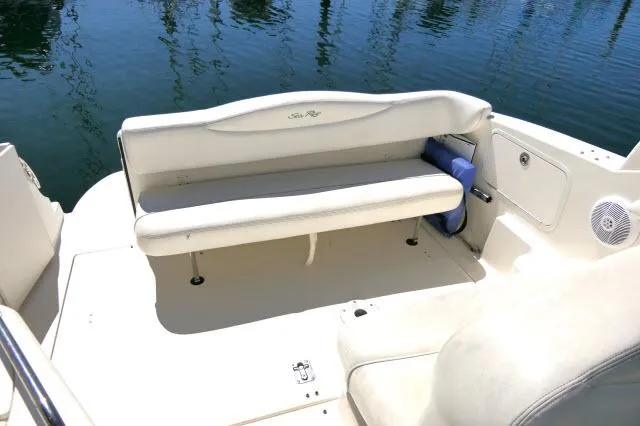 Slide: The Image of 2005 Sea Ray 280 Sundancer boat interior with white seating and water view. - 30