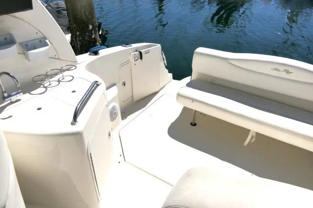 Slide: The Image of 2005 Sea Ray 280 Sundancer boat interior with seating and water view. - 32