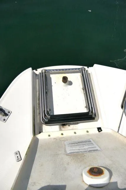 Slide: The Image of 2005 Sea Ray 280 Sundancer boat deck with hatch and railing. - 45