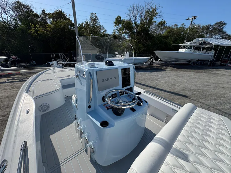 Slide: The Image of 2025 Contender 23 Bay boat with Garmin navigation, sleek design, and spacious seating. - 15