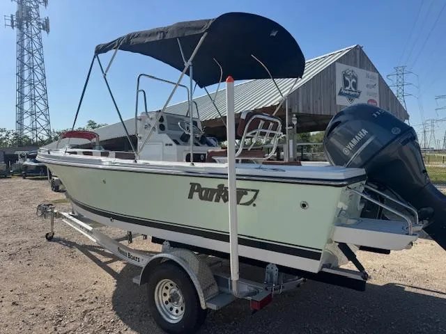 Slide: The Image of 2025 Parker 18SE Center Console boat on trailer with Yamaha outboard motor. - 4