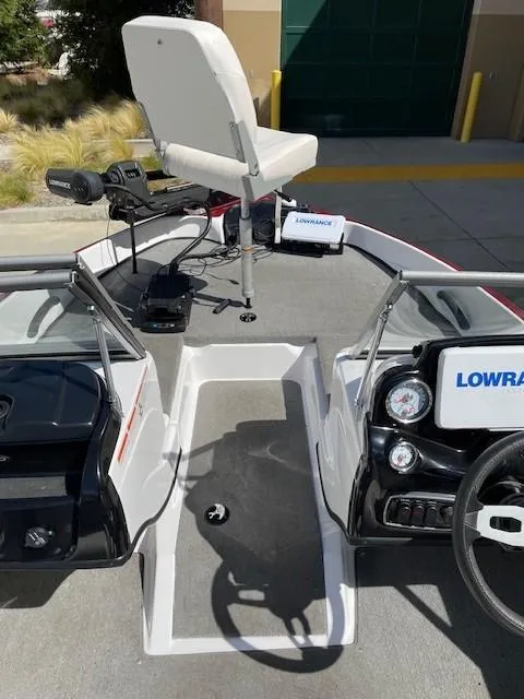 Slide: The Image of 2020 Nitro Z19 Sport boat interior with Lowrance electronics and seating. - 10