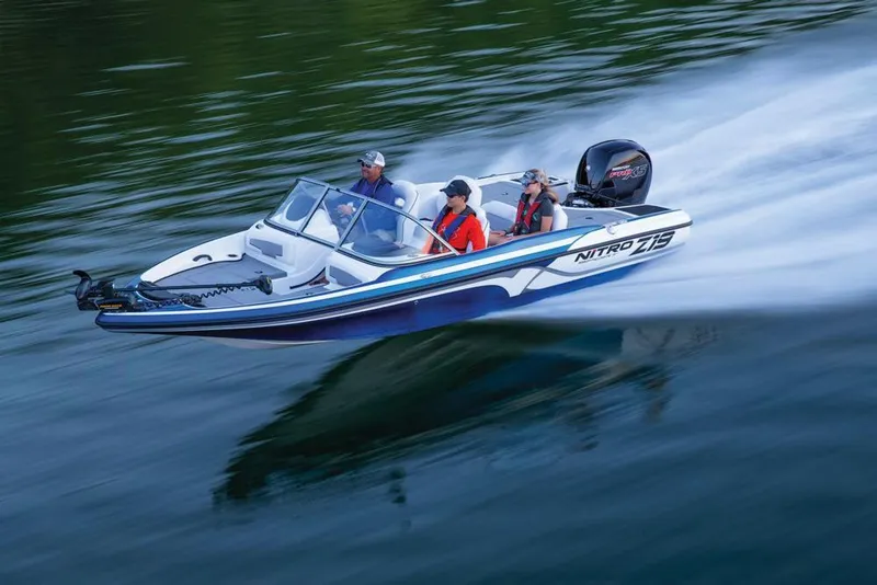 Slide: The Image of 2020 Nitro Z19 Sport boat speeding on water with passengers. - 17
