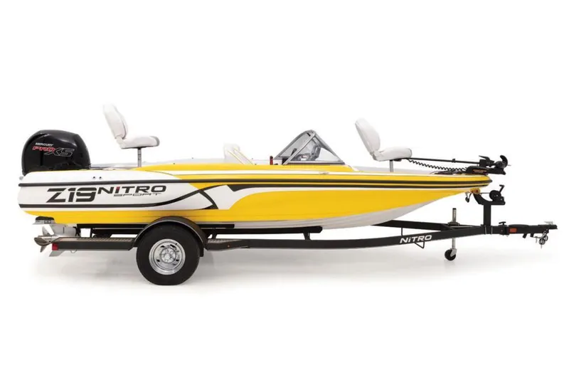 Slide: The Image of 2020 Nitro Z19 Sport boat, yellow and white, on trailer, side view. - 26