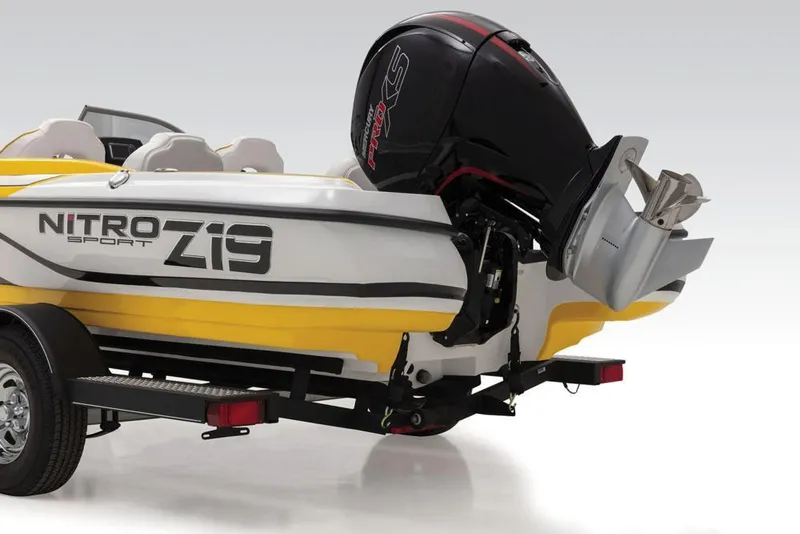 Slide: The Image of 2020 Nitro Z19 Sport boat with outboard motor, yellow and white design. - 35