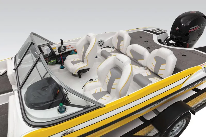 Slide: The Image of 2020 Nitro Z19 Sport boat interior with white and yellow seating, steering console, and motor. - 42