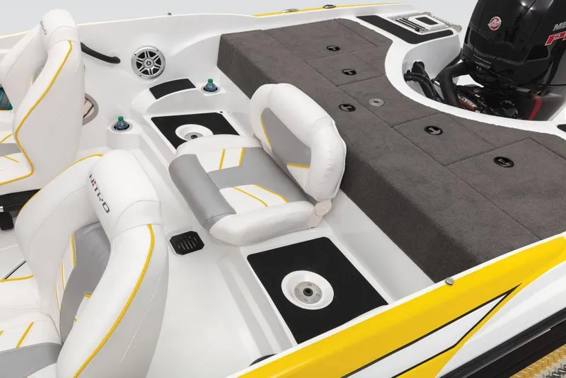 Slide: The Image of 2020 Nitro Z19 Sport boat interior with white and yellow seating, fishing deck, and motor. - 46