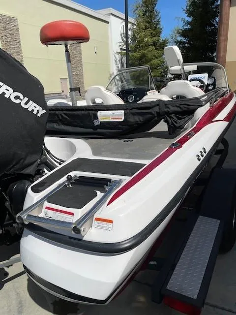 Slide: The Image of 2020 Nitro Z19 Sport boat with Mercury engine, parked outdoors. - 5