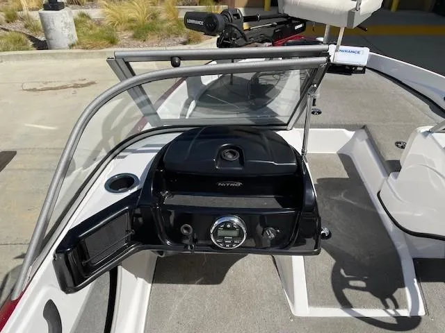 Slide: The Image of 2020 Nitro Z19 Sport boat dashboard with steering wheel and controls. - 9