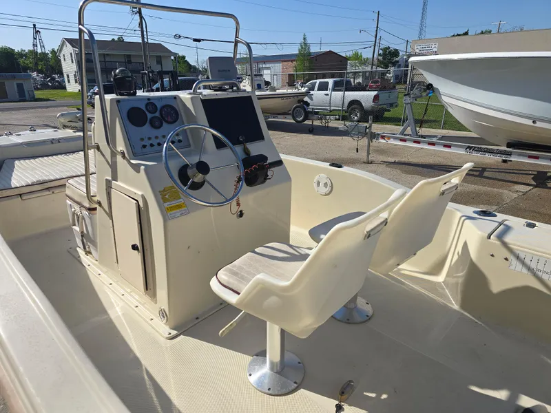 Slide: The Image of 1993 Scout 172 Sportfish boat interior with steering console and two seats. - 10