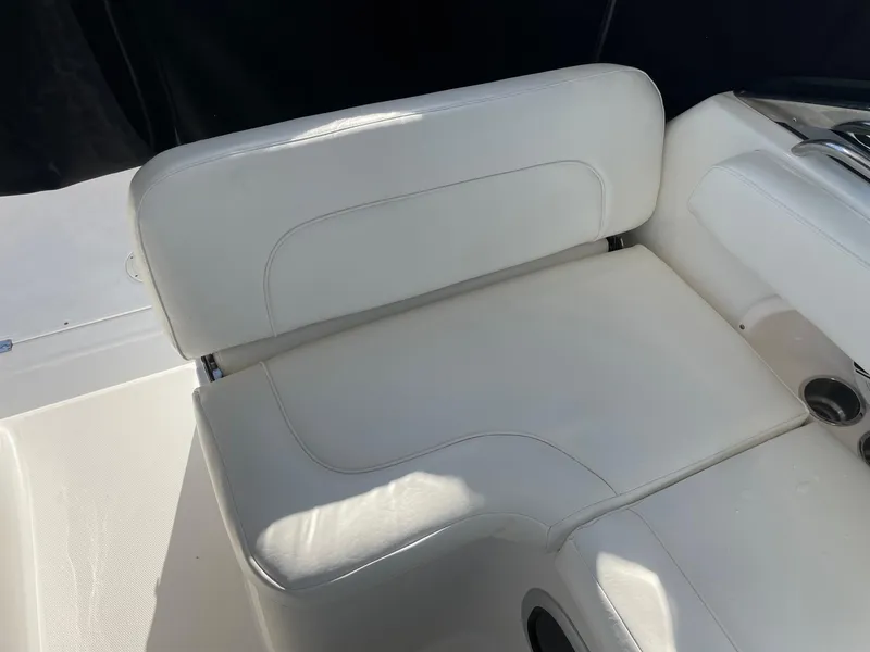 Slide: The Image of 2009 Robalo R305 Walkaround boat seat, white upholstery, sleek design. - 27
