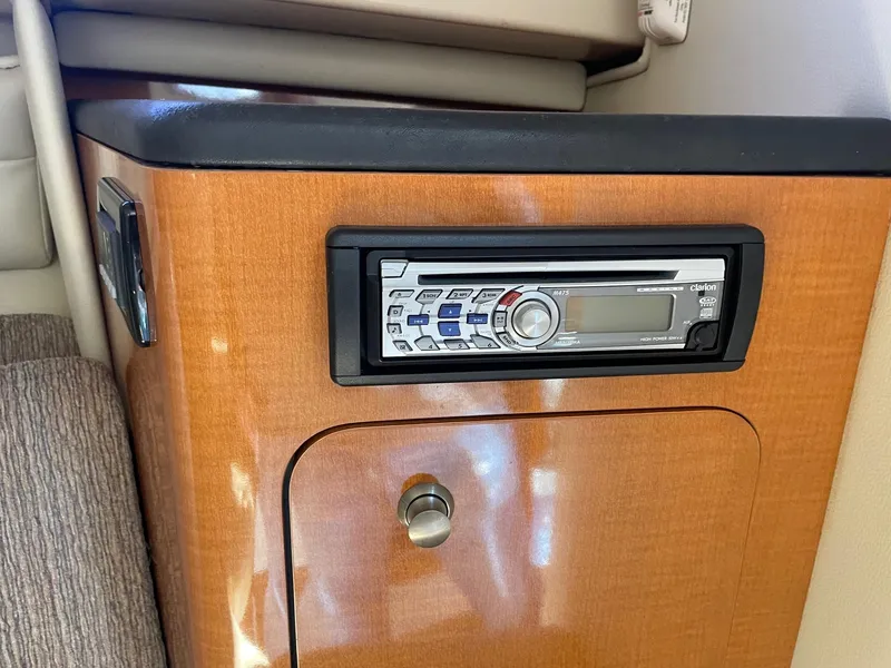 Slide: The Image of 2009 Robalo R305 Walkaround cabin with stereo system and wooden cabinetry. - 36