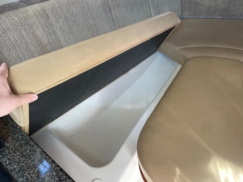 Slide: The Image of 2009 Robalo R305 Walkaround boat interior storage compartment under seat. - 42