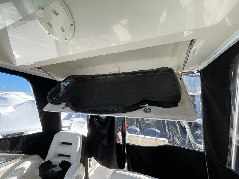 Slide: The Image of 2009 Robalo R305 Walkaround interior with storage compartment and seating. - 45