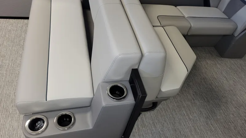 Slide: The Image of Luxurious seating with cup holders in a 2025 Qwest E22 model. - 12