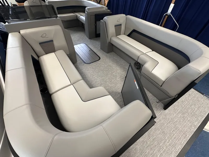 Slide: The Image of Luxurious interior of 2025 Qwest 8522 Lanai Tri-Toon boat with plush seating. - 2