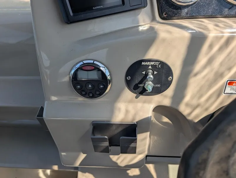 Slide: The Image of Control panel of a 2006 Sea Ray 240 Sundancer boat with Marinco switch. - 16