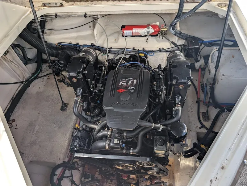 Slide: The Image of Engine compartment of a 2006 Sea Ray 240 Sundancer boat with visible fire extinguisher. - 31