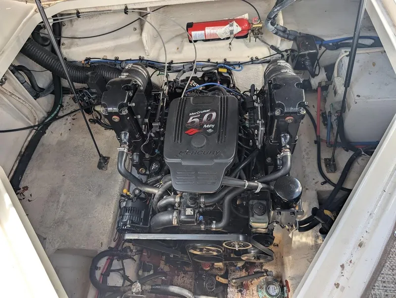 Slide: The Image of Engine compartment of a 2006 Sea Ray 240 Sundancer boat with visible fire extinguisher. - 32