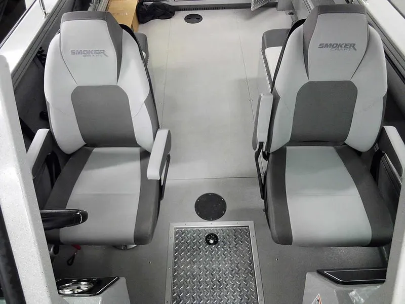 Slide: The Image of 2024 Smoker Craft Phantom 20 X2 OS interior with two gray seats and metal flooring. - 15