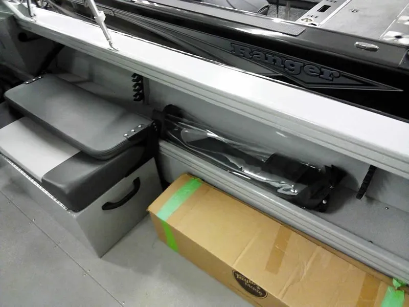 Slide: The Image of 2024 Smoker Craft Phantom 20 X2 OS interior storage with seating and equipment. - 24