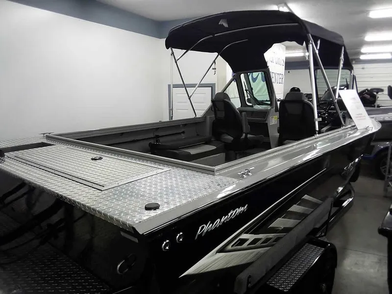 Slide: The Image of 2024 Smoker Craft Phantom 20 X2 OS boat with canopy in showroom. - 32