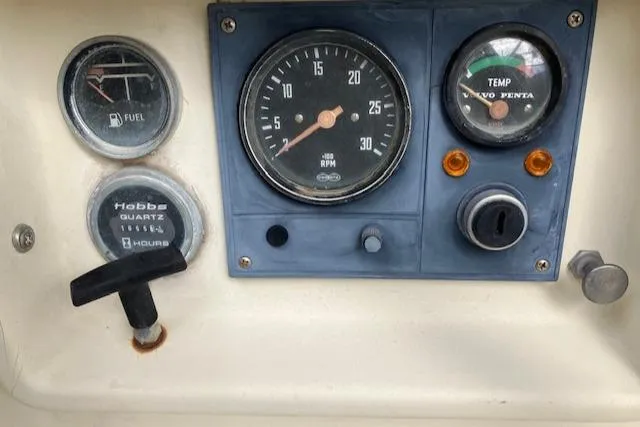 Slide: The Image of Instrument panel of 1981 S2 11.0A with RPM, fuel, and temperature gauges. - 15