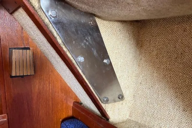 Slide: The Image of Interior detail of 1981 S2 11.0A sailboat showing metal bracket and wood trim. - 34