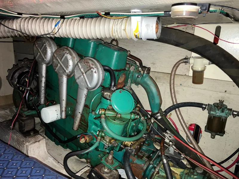 Slide: The Image of 1981 S2 11.0A engine compartment with green marine engine and wiring. - 37