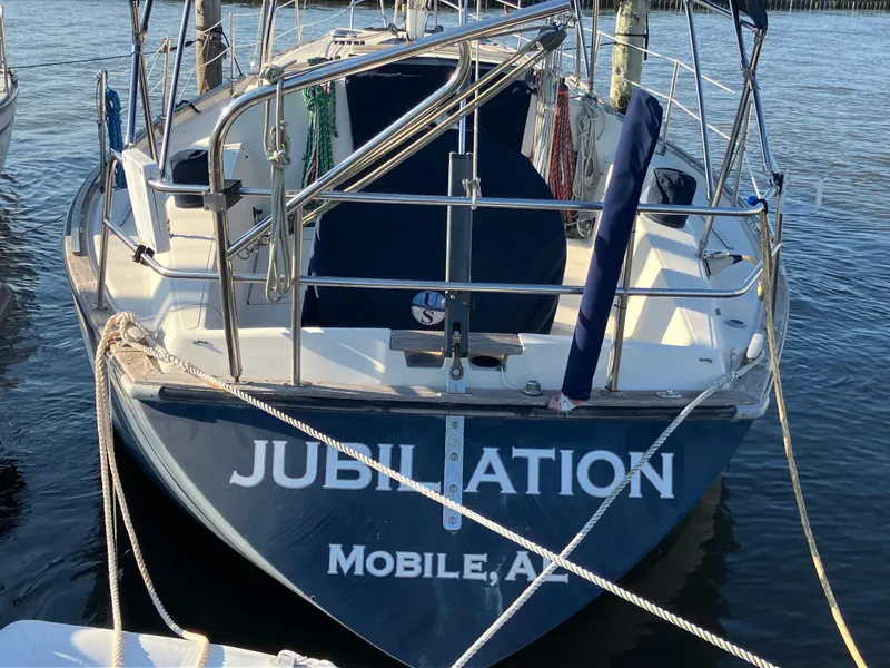 Slide: The Image of S2 11.0A sailboat named "Jubilation" docked in Mobile, Alabama, 1981 model. - 4