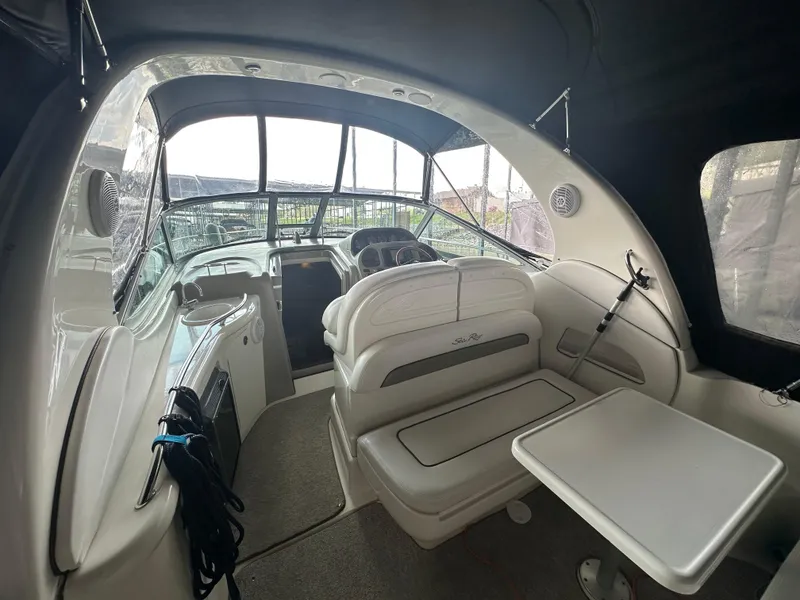 Slide: The Image of Interior of a 2006 Sea Ray 300 Sundancer boat with seating and table. - 5