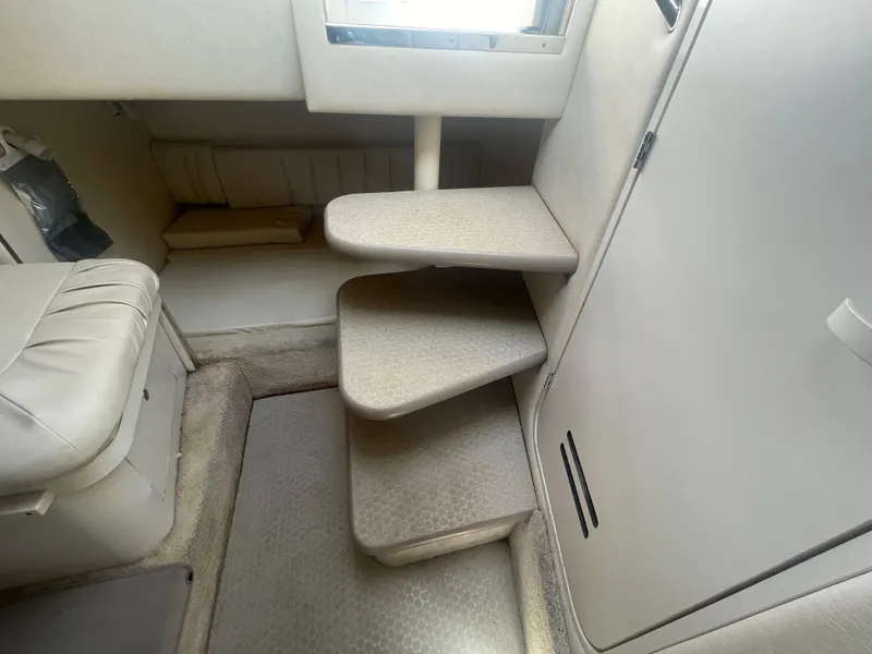 Slide: The Image of Interior stairs of a 2001 Sea Ray 290 Amberjack boat. - 12