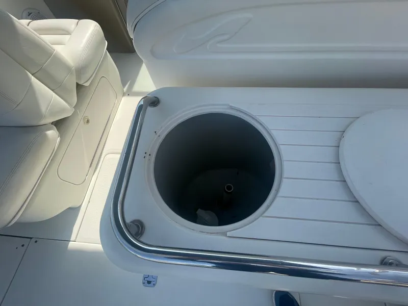 Slide: The Image of 2001 Sea Ray 290 Amberjack boat interior with seating and storage compartment. - 37