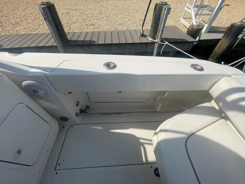 Slide: The Image of 2001 Sea Ray 290 Amberjack boat interior with seating and dock view. - 38