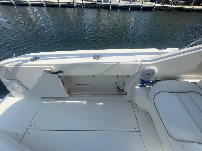 Slide: The Image of 2001 Sea Ray 290 Amberjack boat interior with seating, dockside view. - 39