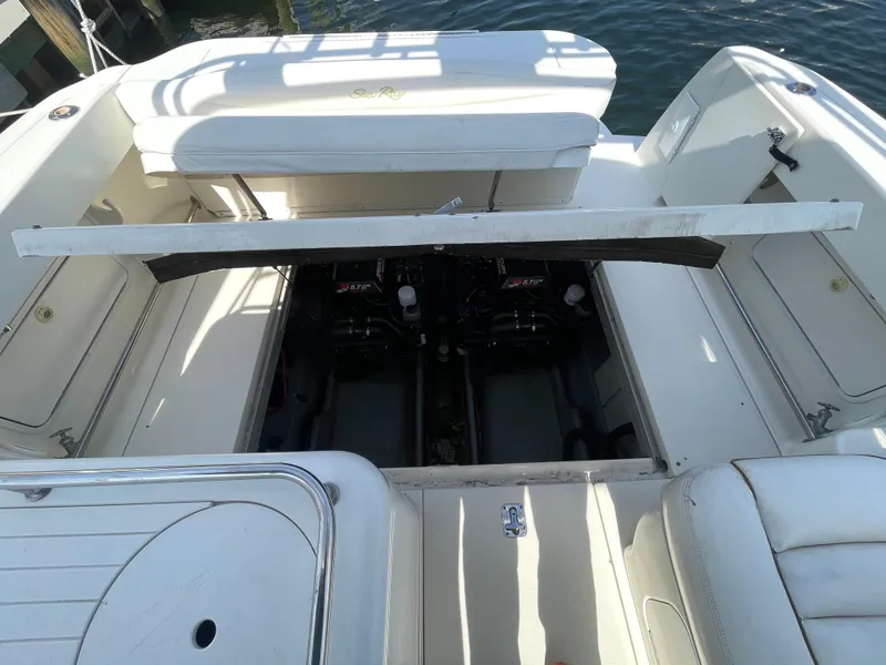 Slide: The Image of 2001 Sea Ray 290 Amberjack boat engine compartment, open view, docked on water. - 41
