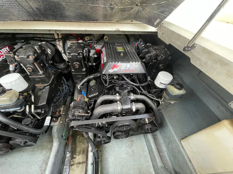 Slide: The Image of Engine compartment of a 2001 Sea Ray 290 Amberjack boat, featuring dual MerCruiser engines. - 43