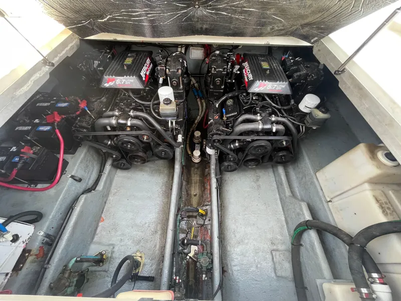 Slide: The Image of Engine compartment of 2001 Sea Ray 290 Amberjack with twin engines and visible components. - 45