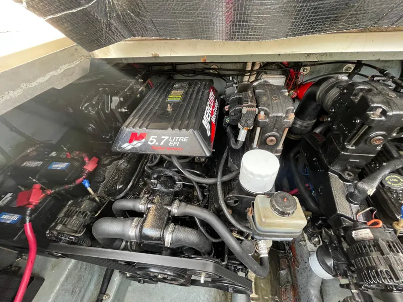 Slide: The Image of Engine compartment of a 2001 Sea Ray 290 Amberjack with 5.7L MerCruiser engine. - 47
