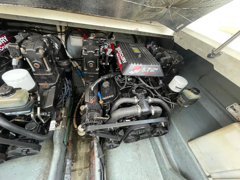 Slide: The Image of Engine compartment of a 2001 Sea Ray 290 Amberjack with twin MerCruiser 5.7L engines. - 49