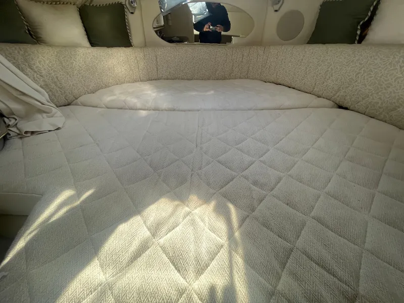 Slide: The Image of Interior cabin of 2001 Sea Ray 290 Amberjack with quilted bedding. - 7