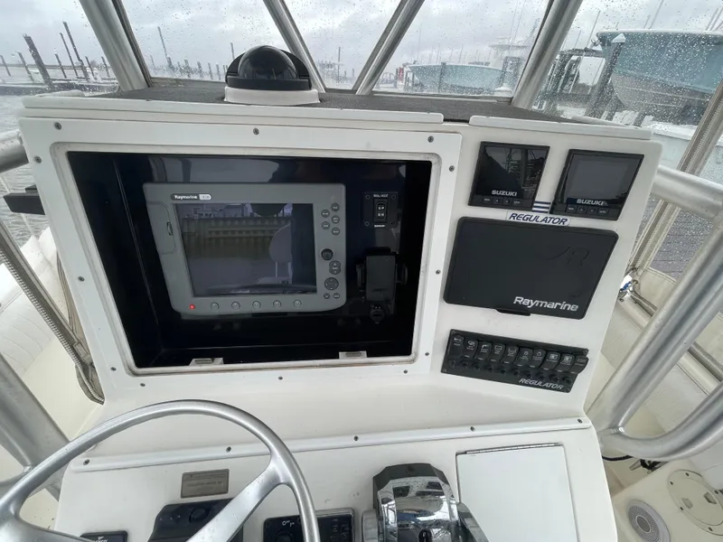 Slide: The Image of Control panel of a 2006 Regulator 24 FS boat with Raymarine electronics. - 9
