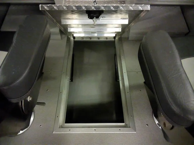 Slide: The Image of 2024 Smoker Craft Phantom 18 X2 interior with storage compartment and seating. - 10