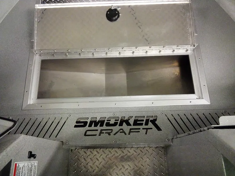 Slide: The Image of 2024 Smoker Craft Phantom 18 X2 interior with storage compartment open. - 11