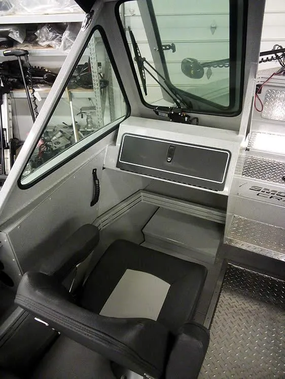 Slide: The Image of 2024 Smoker Craft Phantom 18 X2 boat interior with seating and control panel. - 14