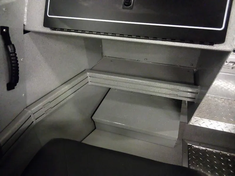 Slide: The Image of 2024 Smoker Craft Phantom 18 X2 interior, featuring storage compartment and seating area. - 15