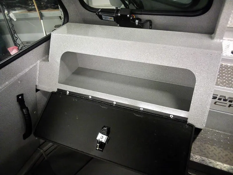 Slide: The Image of 2024 Smoker Craft Phantom 18 X2 interior storage compartment with open lid. - 16